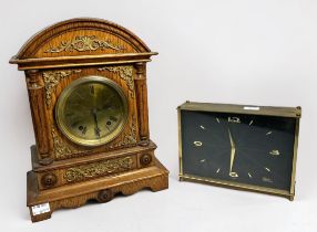 An Edwardian oak-cased mantel clock, with eight-day spring driven movement striking a gong, brass