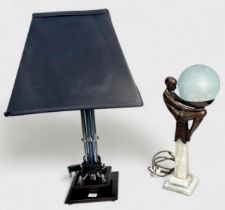 An Art Deco figural table lamp, modelled with a 'flapper girl' supporting a spherical 'crazed glass'