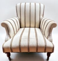 An armchair with sprung seat and back, with scrolled arms and upholstered all-over with brown-