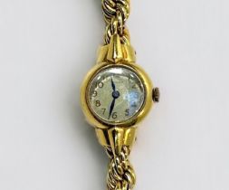 A ladies 18ct gold cased Longines wristwatch, c.1950’s, the silvered dial with gilt Arabic
