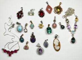 Twenty assorted silver pendants, set with various coloured gemstones including ruby and amethyst