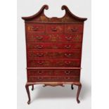 A Chinese Chippendale 'style' tallboy chest, with swan-neck pediment, two short drawers above four
