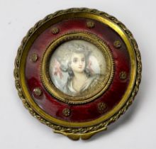 An early 19th century gilt-brass circular box and cover, the top with central 'Gainsborough style'