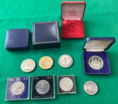 Some commemorative medallions including a 22 carat gold-plated limited edition replica of the Bluton