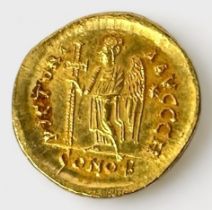 A Byzantine Gold Solidus of Anastasium AD 491-518, Obverse with helmeted pearl-diademed and