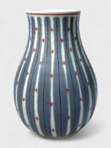 A Poole Pottery 'Freeform' vase, by Jean Cockram, of baluster form decoratd with vertical grey