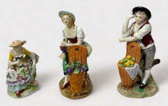 A pair of 19th Century Sitzendorf porcelain figures of fruit sellers, 11cm, and another of a