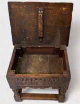 An antique oak Joint stool, of rectangular form with hinged top enclosing storage compartment,