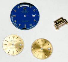 Three various Rolex watch faces, and an 18ct gold watch link.
