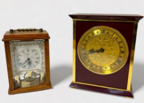 A contemporary brass and composite mantel clock by Luxor, the brass dial with black Roman numerals