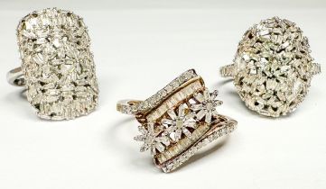 Three various diamond set silver dress rings, estimated total diamond weight 2.50cts, total weight