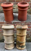 Two various matching pairs of terracotta chimney pots, 63cm and 49cn high