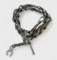 A silver Albert chain of twisted link and cable design, with bulldog clip, t-bar and horseshoe
