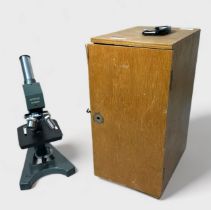 A Japanese microscope by Optolast No.666683, with with 4, 40 and 10 swivel lenses, metallic green