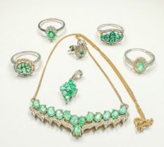 Four assorted silver rings, set with emeralds and diamonds, together with two various emerald set