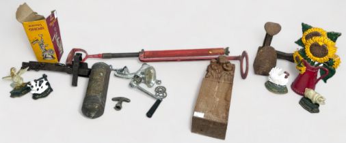 Various metalware including five painted door stops, wrought iron animal trap, hand water-pump,