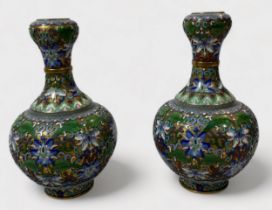 An unusual pair of cloisonné vases, of globular form, with waisted neck to bulbous rim, the entirety
