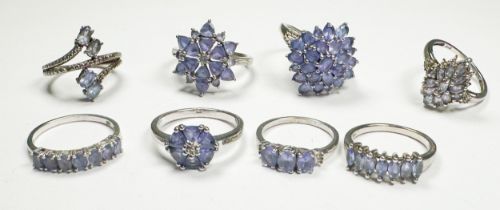Eight various silver dress rings, set with tanzanite, total weight 26.0 grams.