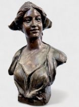 An early 20th Century 'Bronzed' plaster-ceramic cast bust of a Brettagne Milkmaid, signed 'J