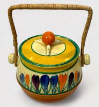 A Clarice Cliff Bizarre Crocus pattern biscuit barrel with cover and basket work handle, with