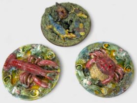 A 'Palissy' style majolica pottery wall-plate, c1900, modelled with reptiles and insetcs on