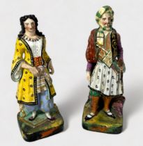 A pair of 19th century continental porcelain figures of an Ottoman couple, painted in polychrome