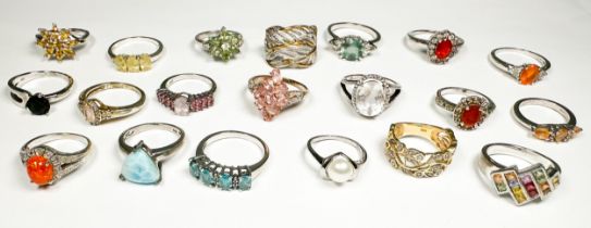 Twenty various silver rings, set with coloured stones and diamonds, including topaz and white