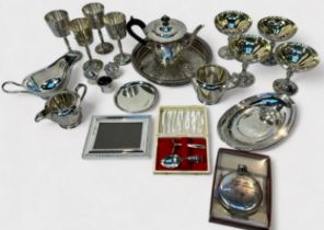 A collection of assorted silver-plated wares including a three-piece tea set by Walker & Hall, a