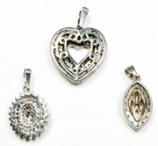 Three diamond set silver pendants, estimated total diamond weight 1.00cts.