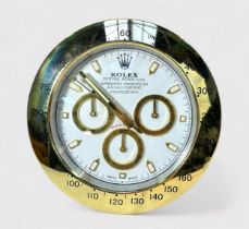 A Rolex authorised dealer display wall clock, modelled as a Rolex Daytona, the white dial with