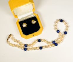 A cultured pearl and lapis lazuli bead necklace, on 9ct gold floral design clasp, weight 29.0 grams,