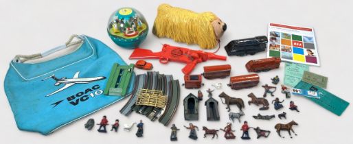 A collection of assorted vintage toys comprising, a West German tin-plate clockwork 'OO' gauge train