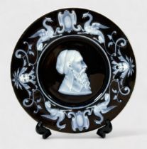 A 19th Century French Porcelain plate with pate-sur-pate opaque white decoration in the classical
