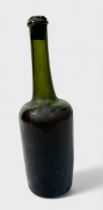 A late 18th century bottle of French Calvados Brandy, hand-made mallet shape bottle with kicked-in