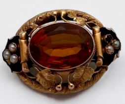A yellow metal, tests as 14ct gold, brooch, set with a large oval-shaped faceted stone to the