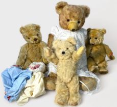 Three 20th Century jointed blonde mohair teddy bears, with glass eyes and vertically stitched noses,