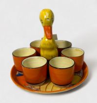 A Clarice Cliff Bizarre ‘Mr Puddleduck’ novelty egg cup cruet set for six, circa 1930, in the ‘