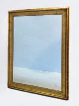 A large modern gilt-wood mirror of rectangular form, scotia and ogee moulded frame and bevelled