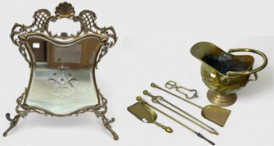 A collection of fireside brassware including a mirrored rococo firescreen, brass fender, coal