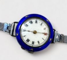 A ladies early 20th century silver and enamel wristwatch, Swiss movment, white enamel dial with