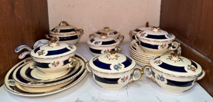 A 17-piece Wedgwood & Co. part tea service, in a blue and gilt floral design to a cream ground,