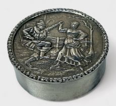 An Elizabeth II silver snuff box, of circular form, the hinged lid decorated in relief with a