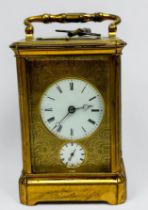 A 19th century brass repeating carriage alarm clock, 8-day movement striking a bell, finely