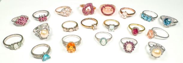 Twenty various silver dress rings, set with diamonds and coloured stones, including ruby, and rose