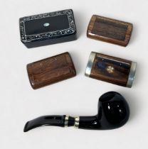 Three assorted hardwood snuff boxes, one with white metal mounts and a yellow metal four leaf clover