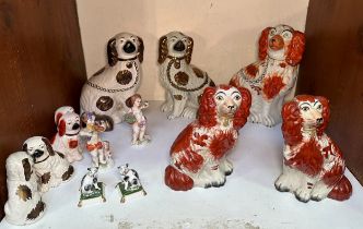 Four various pairs of Staffordshire pottery seated spaniels, a single example, pair of seated