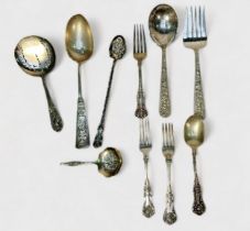 A collection of assorted silver flatware including a Victorian fork by Chawner & Co. an ornately