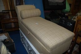 A chaise longue/day bed Ottoman with storage, covered in tweed fabric.