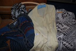 Two blouses and two cardigans, size 18 and XL.