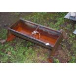 A small galvanised trough, 21 1/2" x 11".
